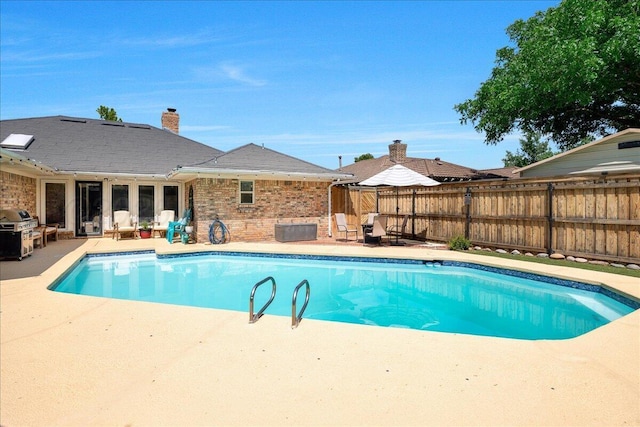 4022 Pinehurst Dr, Amarillo, TX 79109 - view of pool featuring a patio, a grill, and a fenced backyard
