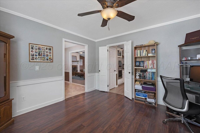 4022 Pinehurst Dr, Amarillo, TX 79109 - home office featuring a ceiling fan, ornamental molding, wood finished floors, and a wainscoted wall