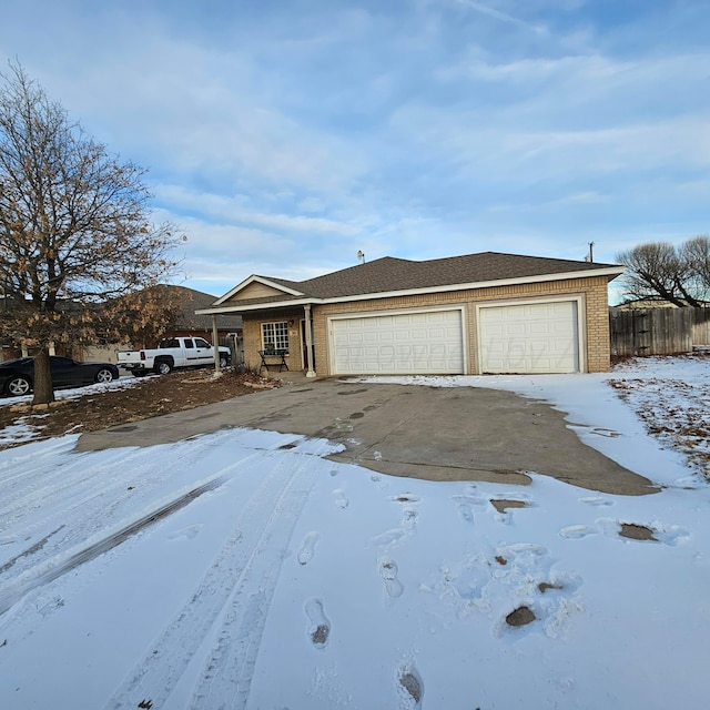 ranch-style home featuring a garage