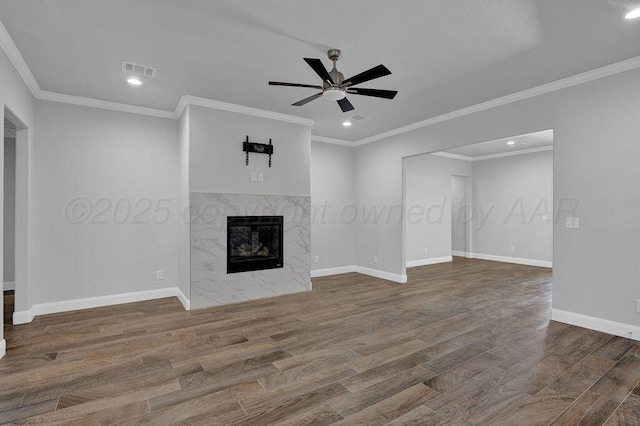 2709 Tampa Bay Ave, Amarillo, TX 79118 - unfurnished living room featuring wood finished floors, a ceiling fan, recessed lighting, baseboards, and a premium fireplace
