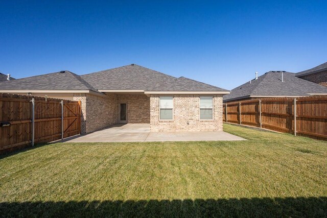 2709 Tampa Bay Ave, Amarillo, TX 79118 - back of house with brick siding, a patio, and roof with shingles