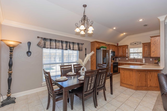 dining space with vaulted ceiling, visible vents, an inviting chandelier, ornamental molding, and light tile patterned floors