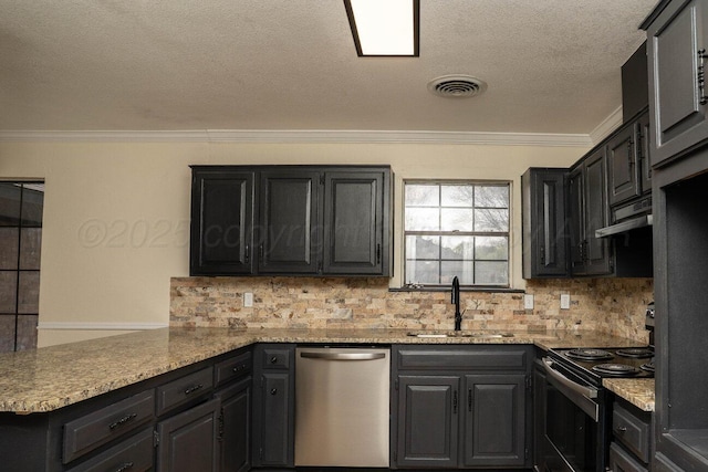 5207 While A Way Rd, Amarillo, TX 79109 - kitchen featuring stainless steel appliances, crown molding, backsplash, a peninsula, and under cabinet range hood