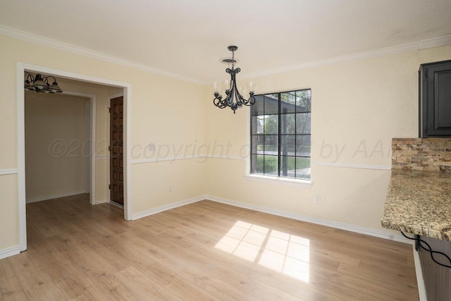 5207 While A Way Rd, Amarillo, TX 79109 - unfurnished dining area with a chandelier, light wood-type flooring, and ornamental molding