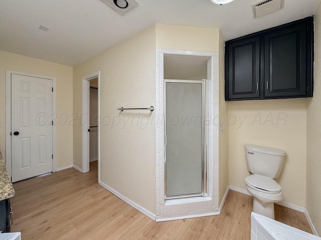 5207 While A Way Rd, Amarillo, TX 79109 - full bathroom featuring wood finished floors, a shower stall, and vanity