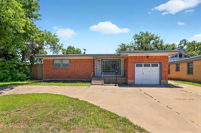 1603 SW 35th Ave, Amarillo, TX 79109 - single story home with driveway, an attached garage, brick siding, and a front lawn