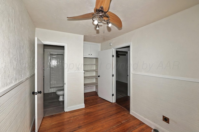 1603 SW 35th Ave, Amarillo, TX 79109 - unfurnished bedroom featuring dark wood finished floors, ceiling fan, and connected bathroom