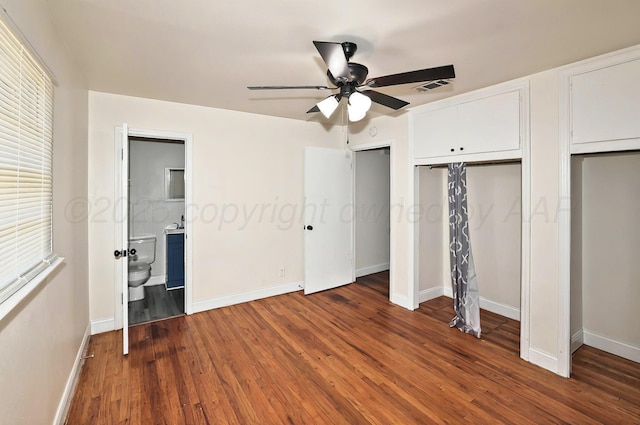 1603 SW 35th Ave, Amarillo, TX 79109 - unfurnished bedroom featuring wood finished floors, baseboards, and multiple closets
