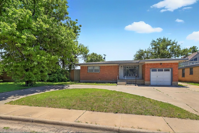 1603 SW 35th Ave, Amarillo, TX 79109 - view of front of house with driveway, an attached garage, and a front lawn
