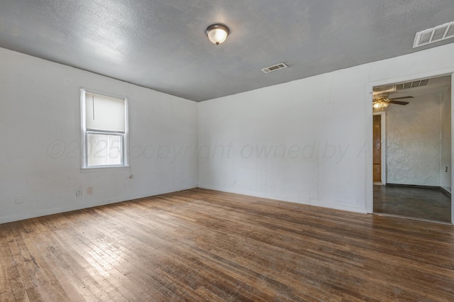 823 Ave N, Sunray, TX 79086 - empty room with wood-type flooring, ceiling fan, and baseboards