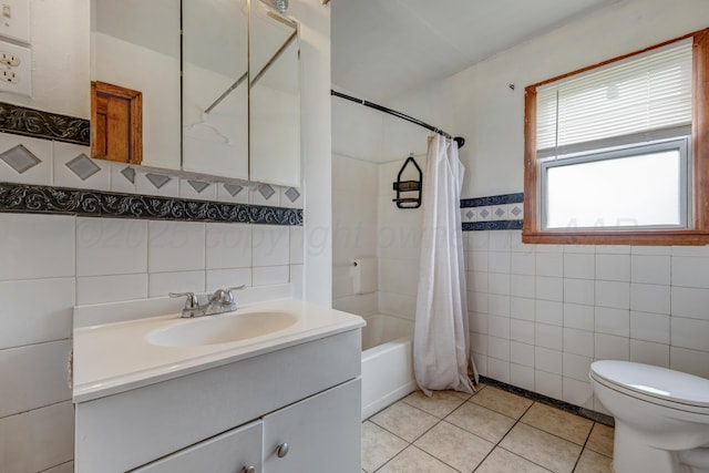 823 Ave N, Sunray, TX 79086 - bathroom with tile walls, tile patterned flooring, vanity, shower / tub combo with curtain, and toilet