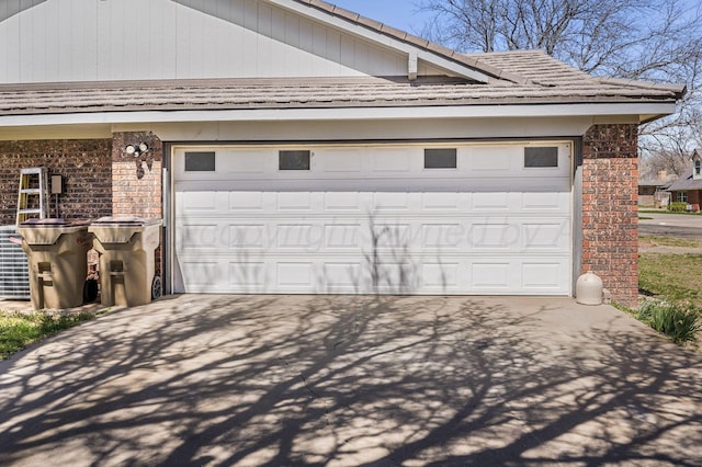 garage featuring driveway