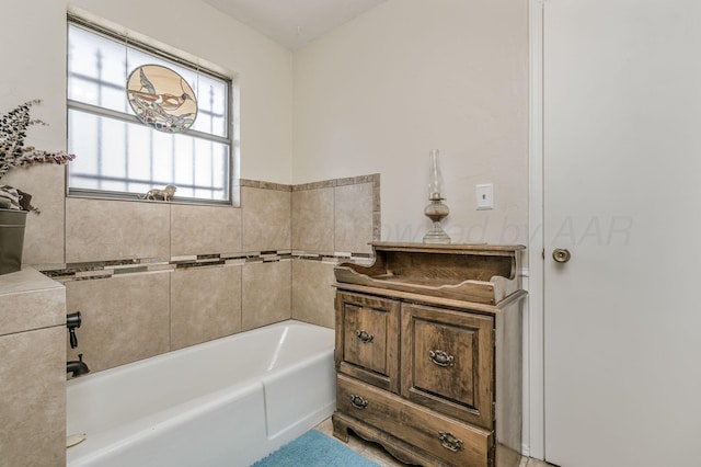 bathroom featuring a tub to relax in