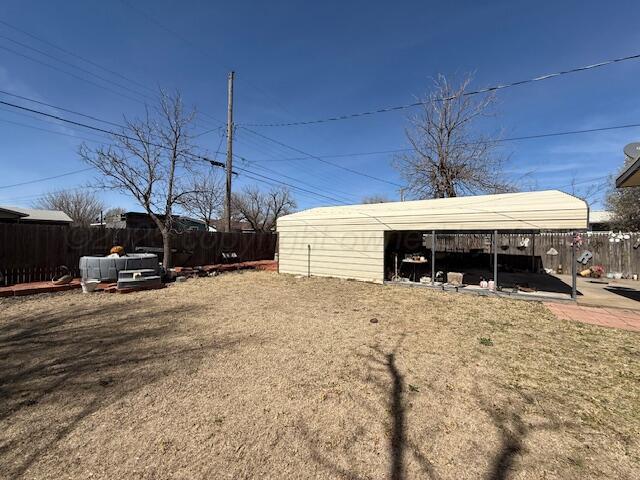 407 N Powell St, Pampa, TX 79065 - view of outdoor structure featuring fence private yard