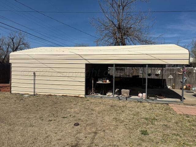 407 N Powell St, Pampa, TX 79065 - view of outbuilding with fence and an outdoor structure
