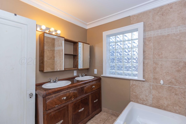 bathroom featuring tile patterned flooring, ornamental molding, vanity, and a tub to relax in