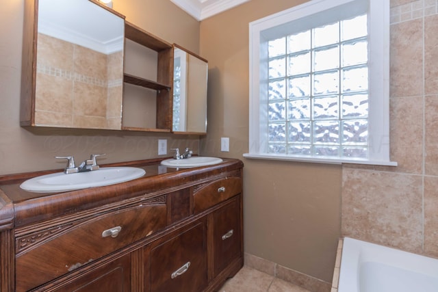 bathroom featuring tile patterned flooring, a bath, crown molding, and vanity