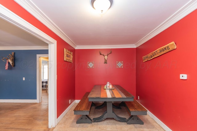 dining space featuring ornamental molding