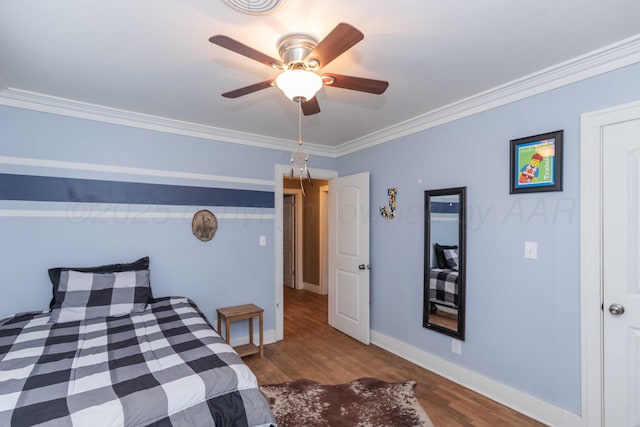 bedroom with wood-type flooring, ornamental molding, and ceiling fan