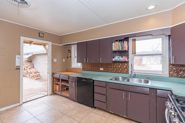 kitchen with black dishwasher, sink, dark brown cabinets, and stainless steel gas stove