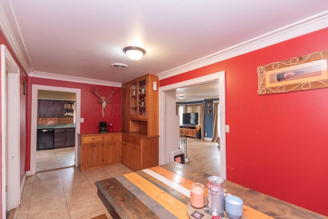 tiled dining area with crown molding