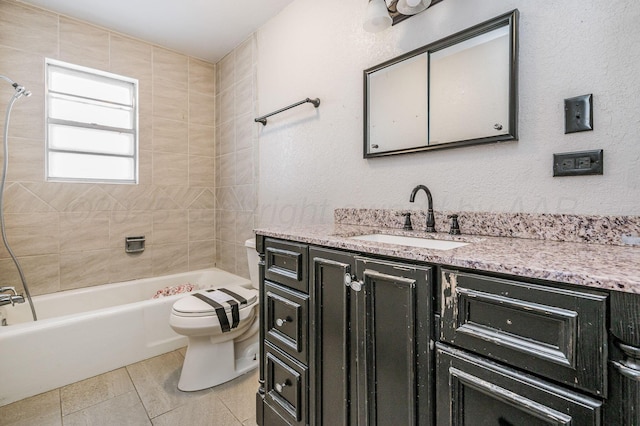 full bathroom with tiled shower / bath combo, vanity, tile patterned flooring, and toilet