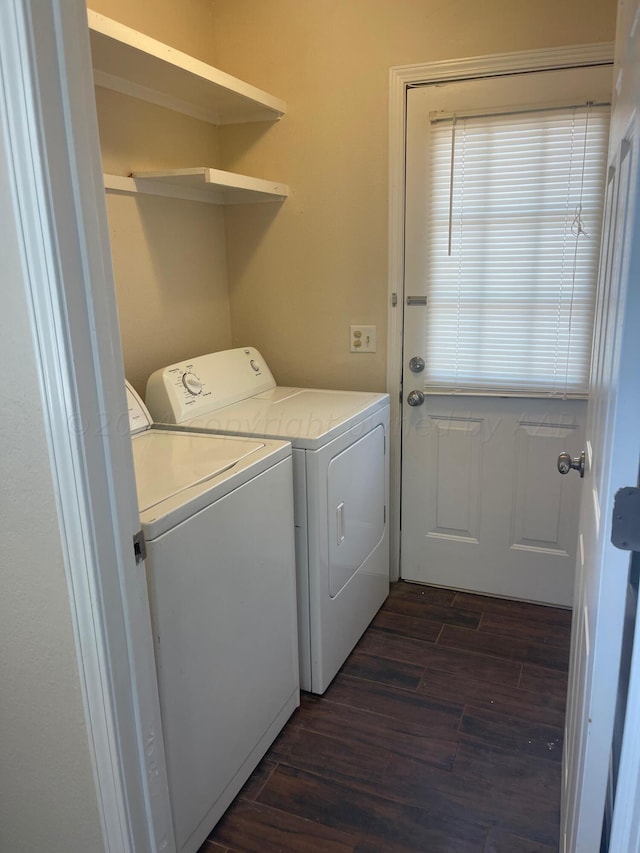 laundry room with separate washer and dryer and dark hardwood / wood-style floors