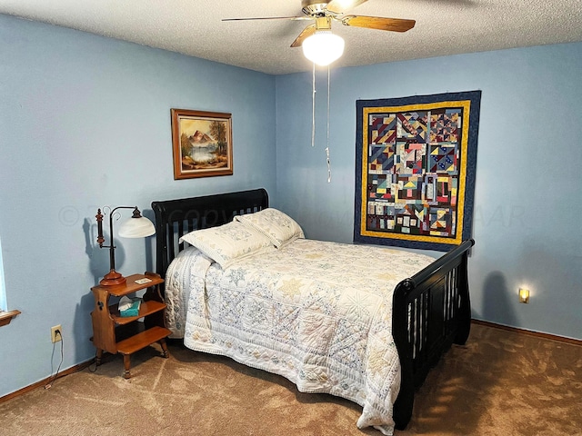 bedroom with carpet, a textured ceiling, and ceiling fan