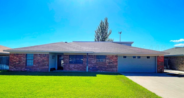 single story home with a garage and a front lawn