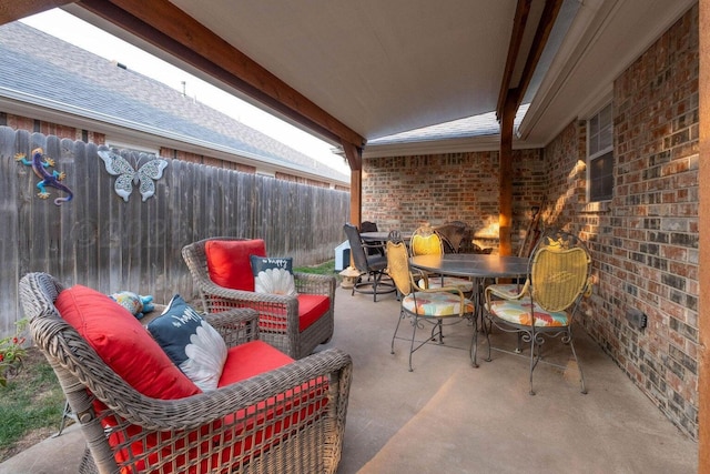 view of patio / terrace with outdoor dining space and fence