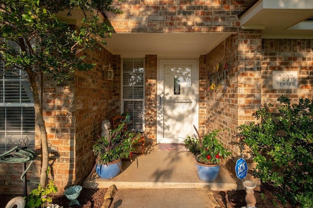 entrance to property with brick siding