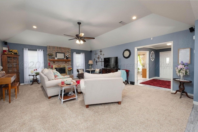 living area with vaulted ceiling, a brick fireplace, visible vents, and light carpet