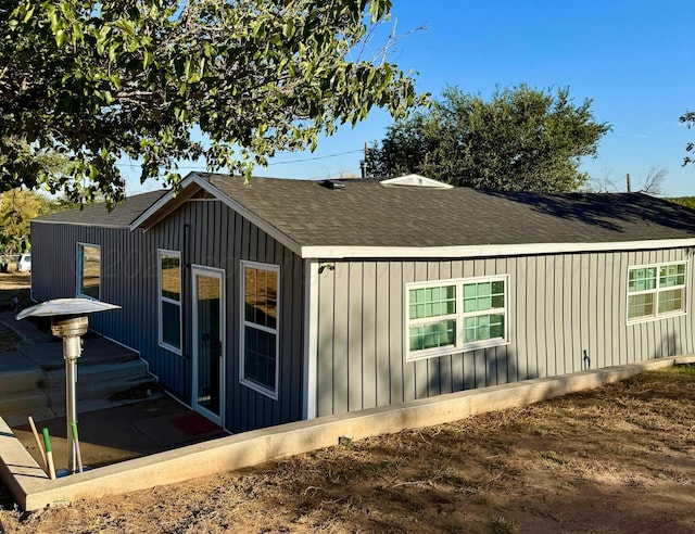 view of side of home with a patio area