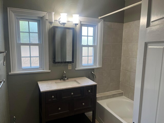 2409 S Tyler St, Amarillo, TX 79109 - full bath featuring vanity, plenty of natural light, and shower / bath combination