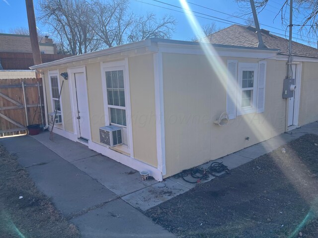 2409 S Tyler St, Amarillo, TX 79109 - view of property exterior featuring cooling unit and roof with shingles