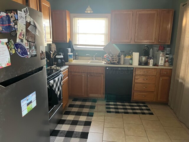 2409 S Tyler St, Amarillo, TX 79109 - kitchen featuring appliances with stainless steel finishes, a sink, light countertops, and light tile patterned flooring