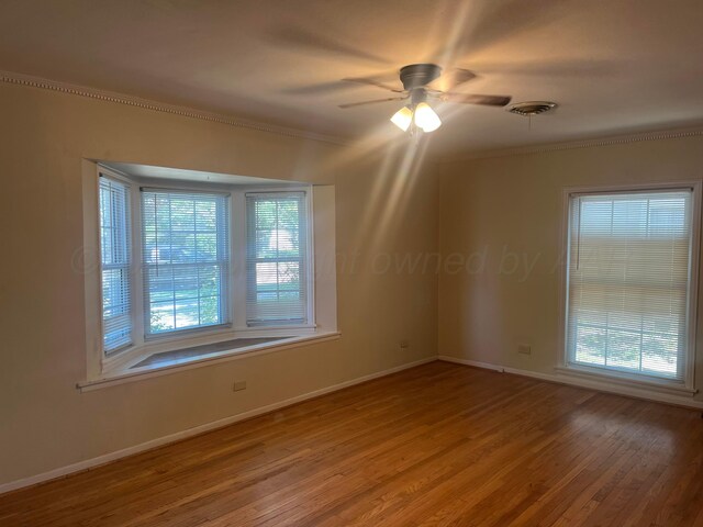 2409 S Tyler St, Amarillo, TX 79109 - empty room with ceiling fan, wood finished floors, baseboards, and ornamental molding