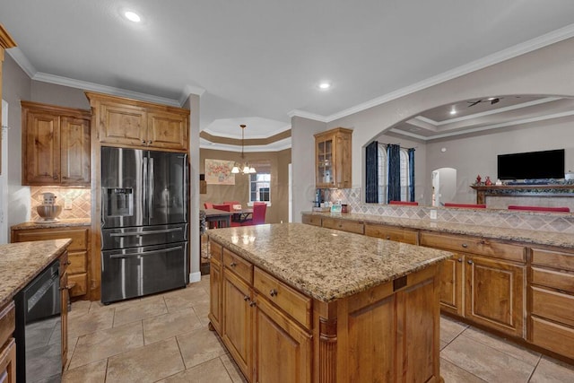 6905 Spring Cherry Ln, Amarillo, TX 79124 - kitchen with stainless steel fridge with ice dispenser, arched walkways, black dishwasher, a kitchen island, and backsplash