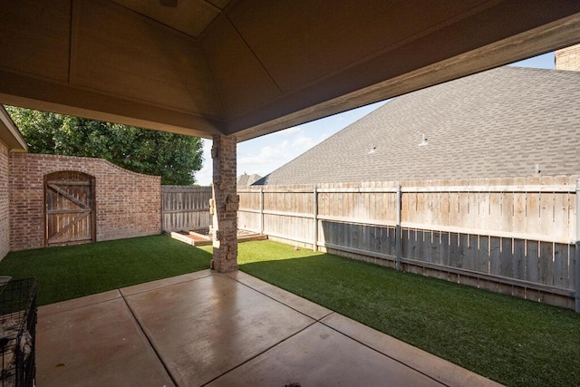 6905 Spring Cherry Ln, Amarillo, TX 79124 - fenced backyard with a patio and a storage unit