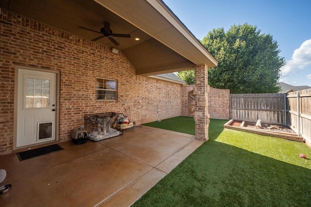 6905 Spring Cherry Ln, Amarillo, TX 79124 - fenced backyard featuring a ceiling fan and a patio area