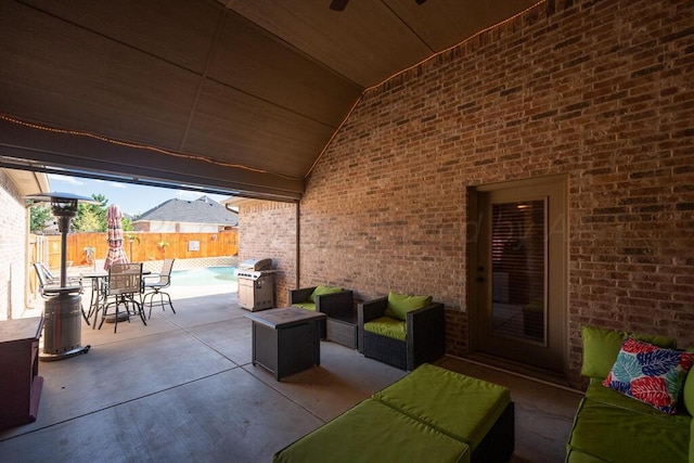 6905 Spring Cherry Ln, Amarillo, TX 79124 - fenced backyard featuring an outdoor hangout area, a patio area, outdoor dining area, and grilling area