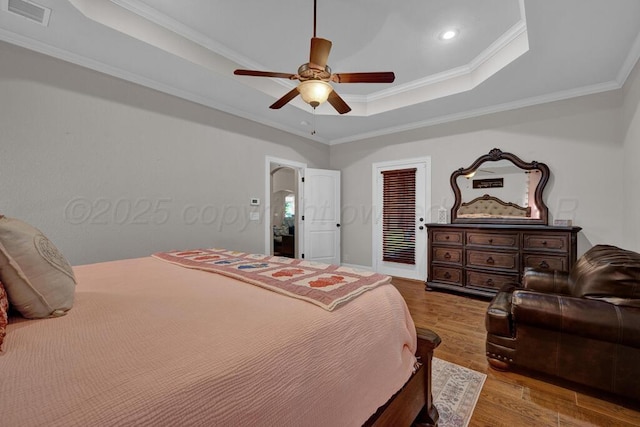 6905 Spring Cherry Ln, Amarillo, TX 79124 - bedroom with a raised ceiling, crown molding, wood finished floors, recessed lighting, and ceiling fan