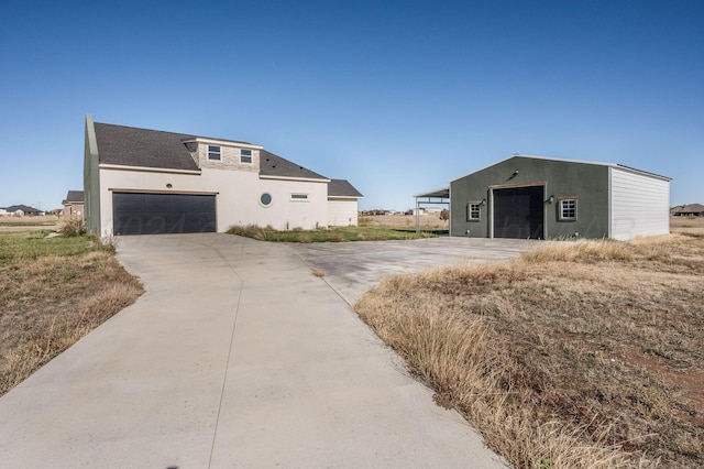 exterior space featuring a garage and stucco siding