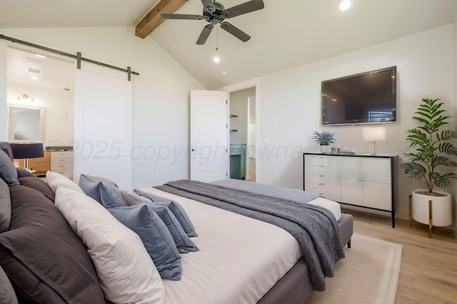 bedroom featuring vaulted ceiling with beams, a barn door, connected bathroom, recessed lighting, and light wood-style floors