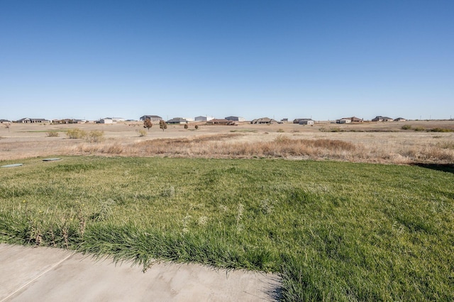 view of yard with a rural view