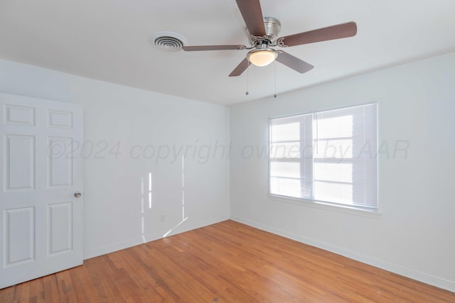 unfurnished room featuring ceiling fan and light wood-type flooring