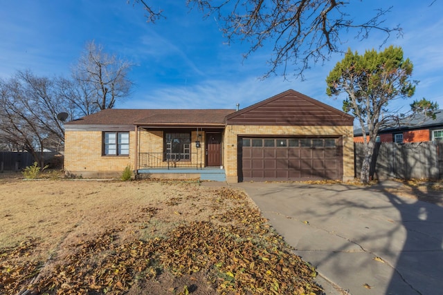 ranch-style house with covered porch and a garage