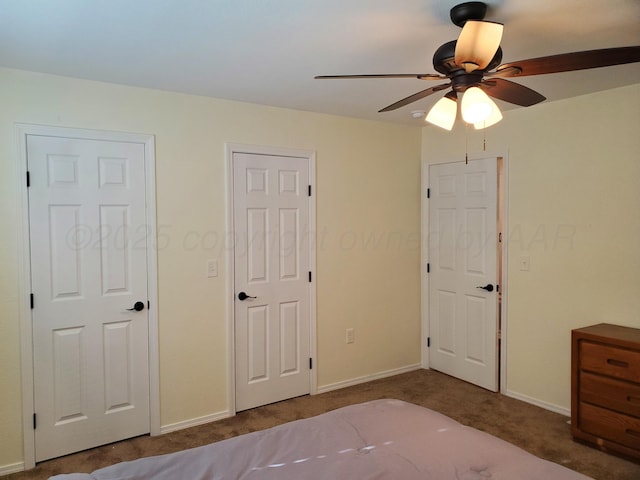 unfurnished bedroom with ceiling fan and carpet flooring