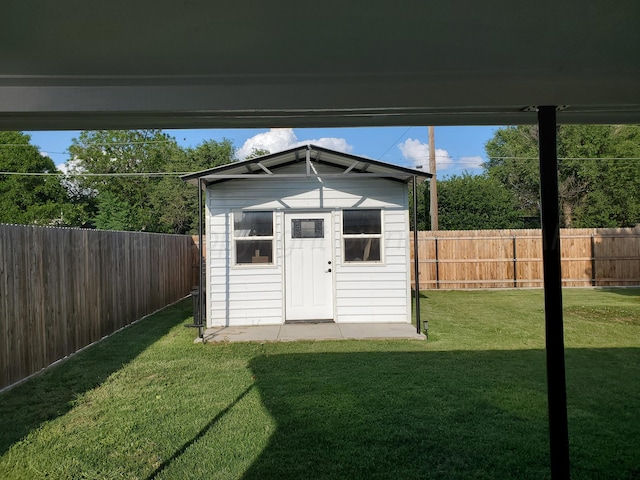 view of outbuilding featuring a yard