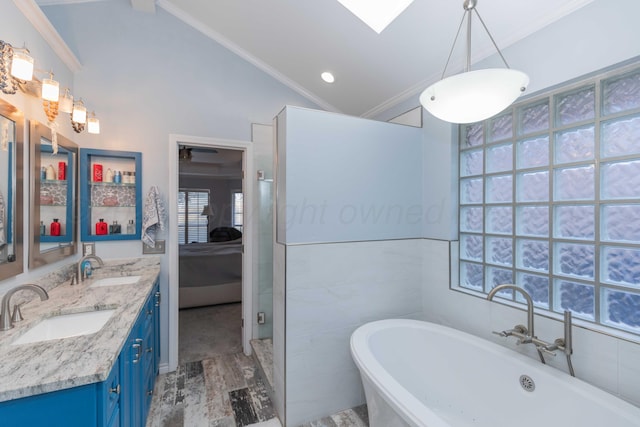 bathroom featuring vanity, lofted ceiling, crown molding, hardwood / wood-style flooring, and tile walls